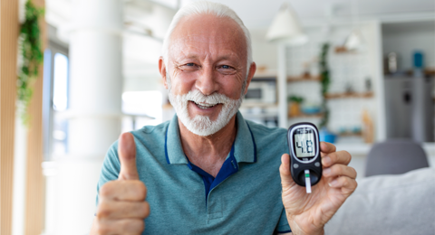 Elderly Man With Blood Glucose Monitor Normal