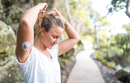 Woman With Dexcom CGM On Arm R
